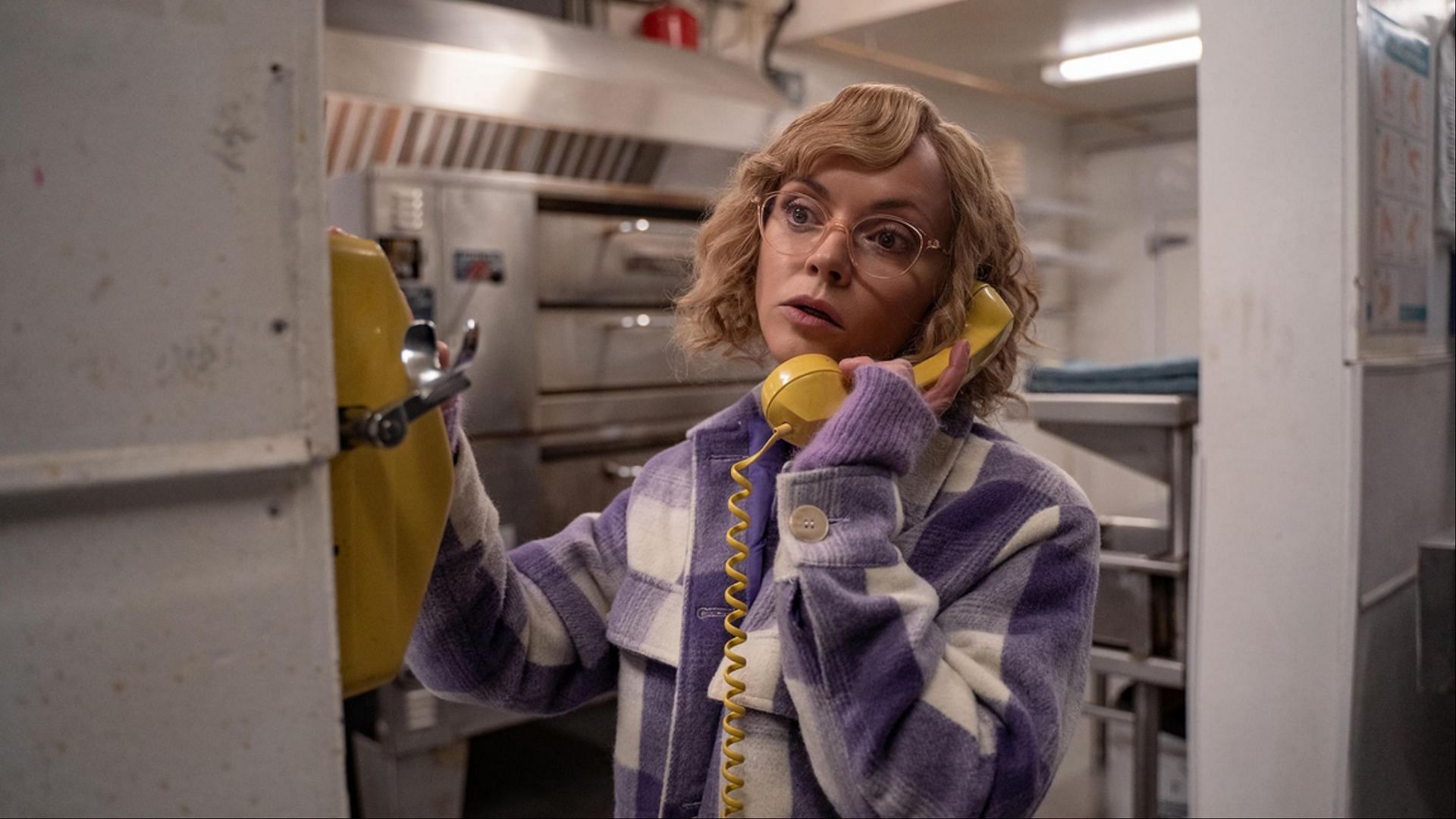 Christina Ricci as Misty answers a mysterious call. (Image via Netflix)